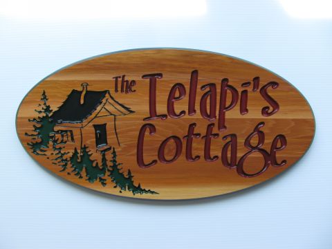 Oval routered wood sign trees shack name cottage